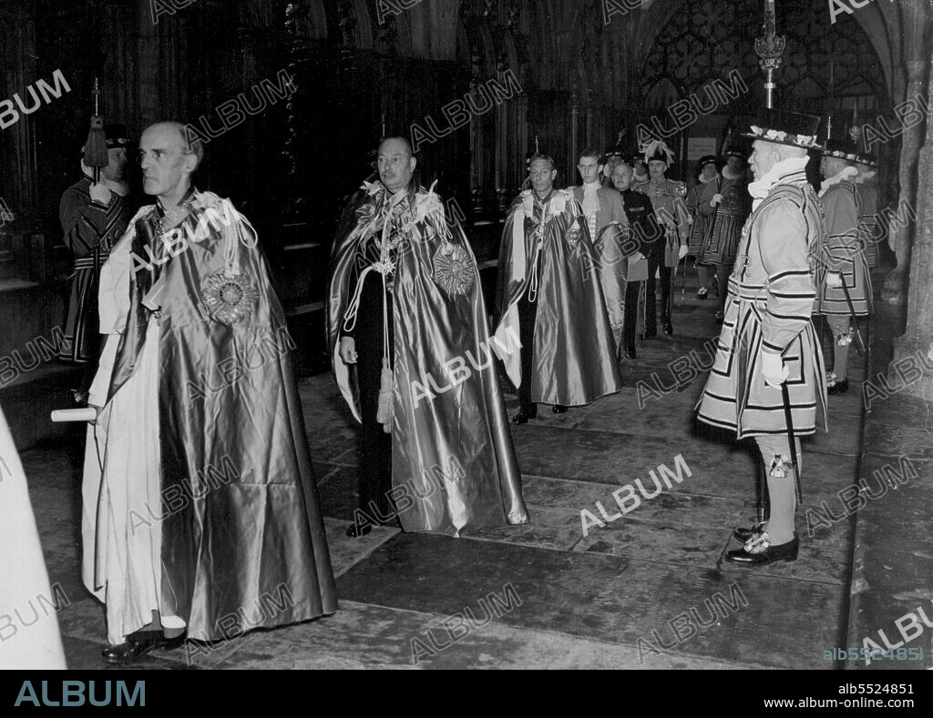 Service of the Order of the Bath -- By Command of the King Sovereign of the order, 36 knights grand cross of the Order of the Bath were installed in the chapel of King  Henry VII, Westminster Abbey on Empire Day. The King enrolled the Duke of Gloucester as great master of the order. The Queen, though not a member of the order, accompanied the King in the procession between Abbey Chapter house and the Chapel.The Duke of Gloucester followed by the King at the Abbey during the ceremony. June 14, 1951.