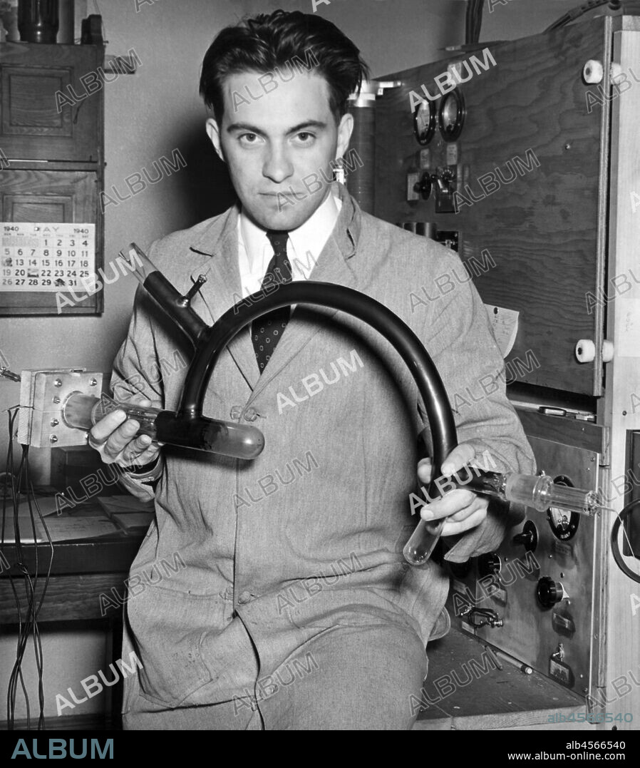 Minneapolis, Minnesota, 1940 University of Minnesota Professor Alfred Nier holding the glass mass spectrometer tube that he used to isolate uranium-235, which was used to demonstrate that it could undergo fission.