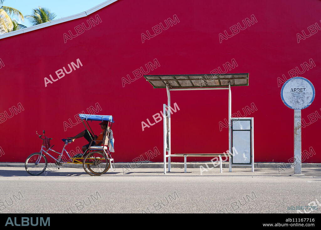 Taxi Brousse Bus stop and a cyclo-pousse in Morondava, Western Madagascar, Africa.