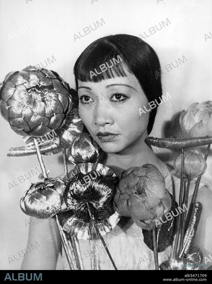 Anna May Wong (January 3, 1905 - February 3, 1961) was an American actress, the first Chinese American movie star, and the first Asian American to become an international star. Her long and varied career spanned both silent and sound film, television, stage, and radio. Born near the Chinatown neighborhood of Los Angeles to second-generation Chinese-American parents, Wong became infatuated with the movies and began acting in films at an early age. During the silent film era, she acted in The Toll of the Sea (1922), one of the first movies made in color and Douglas Fairbanks' The Thief of Bagdad (1924). Wong became a fashion icon, and by 1924 had achieved international stardom. Frustrated by the stereotypical supporting roles she reluctantly played in Hollywood, she left for Europe in the late 1920s, where she starred in several notable plays and films, among them Piccadilly (1929). She spent the first half of the 1930s traveling between the United States and Europe for film and stage work. Wong was featured in films of the early sound era, such as Daughter of the Dragon (1931) and Daughter of Shanghai (1937), and with Marlene Dietrich in Josef von Sternberg's Shanghai Express (1932). In 1935 Wong was dealt the most severe disappointment of her career, when Metro-Goldwyn-Mayer refused to consider her for the leading role in its film version of Pearl S. Buck's The Good Earth, choosing instead the German actress Luise Rainer to play the leading role. Wong spent the next year touring China, visiting her family's ancestral village and studying Chinese culture. In the late 1930s, she starred in several B movies for Paramount Pictures, portraying Chinese-Americans in a positive light. She paid less attention to her film career during World War II, when she devoted her time and money to helping the Chinese cause against Japan. Wong returned to the public eye in the 1950s in several television appearances as well as her own series in 1951, The Gallery of Madame Liu-Tsong, the first U.S. television show starring an Asian-American. She had been planning to return to film in Flower Drum Song when she died in 1961, at the age of 56.
