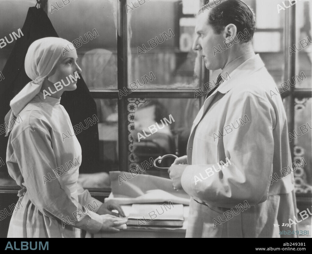 CAROLE LOMBARD and ROBERT COOTE in VIGIL IN THE NIGHT, 1940, directed by GEORGE STEVENS. Copyright RKO.