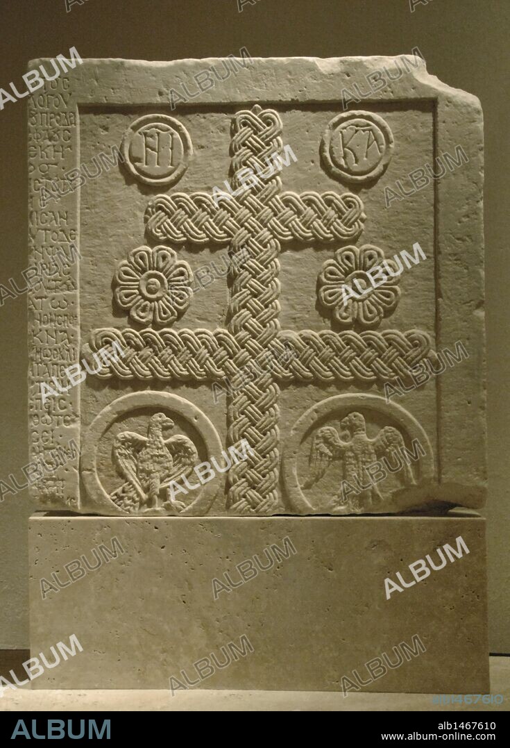 BYZANTINE ART. GREECE. Marble slab with lateral inscription and reliefs  based in crosses, rosettes and eagles within a circle. Dated from latest XI century and early XII century. Byzantine Museum. Athens.