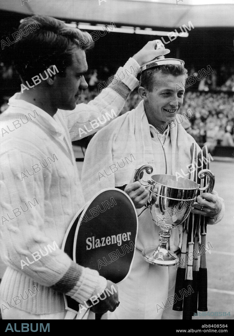 Nielsen Crowns The Victor -- Kurt Nielsen, of Denmark, 'crowns' America's Tony Trabert with the top of the trophy which the American had just won by beating him in the final of the men's singles in the Lawn Tennis championships at Wimbledon this afternoon (Friday).Trabert had just received thetrophy from the Duchess of Kent, President of the All-England Lawn Tennis club. July 01, 1955. (Photo by Reuterphoto).
