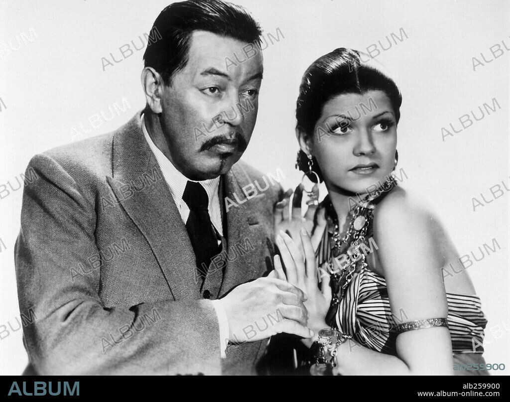 RITA HAYWORTH and WARNER OLAND in CHARLIE CHAN IN EGYPT, 1935, directed by LOUIS KING. Copyright FOX FILMS.