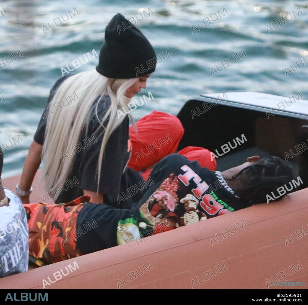 MIAMI, FL - MAY 07: (EXCLUSIVE COVERAGE) Kylie Jenner goes back to being a blonde (like she was with X-Boyfriend Tyga) seen here are the first pictures of a very ''BLONDE'' Kylie Jenner and her new boyfriend Jacques Webster, Jr. better know as hip-hop singer Travis Scott. The lovebirds arrived by yacht and dined in a private back room of the exclusive restaurant the River Yacht Club where Kylie and Travis looked very happy and were spotted kissing and being very romantic while bodyguards kept out unwanted people. The new couple had a blast at the exclusive waterside restaurant where they were joined by Miami-based restaurant, nightlife and hospitality entrepreneur David Grutman and his wife Isabela Rangel. While Kylie drank Evian water all night her new man Rapper Travis Scott was in full party mode and did a total of 17 shots of Don Julio 1942â„¢- World's First Luxury Tequilaâ€Ž with their friends. Perhaps the Tequila took its toll, as Travis looked a little under the weather on the boat ride home. The couple spent a total of $2000.00 with their friends and left a very generous additional $100.00 in addition to the 20% tip at The River Yacht Club Restaurant in Miami on May 7, 2017 in Miami, Florida..People: Kylie Jenner, Travis Scott. 07/05/2017