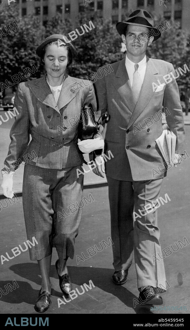Hiss and Wife Stroll In Sunshine
Alger Hiss, former state department official, now on trial for Perjury, Strolls before the Federal Courthouse in New York, June 3, where the trial is taking place, with Mrs. Hiss, Whittaker Chambers, self-styled Communist Espionage Courier who claimed Hiss gave him State department documents, was cross-Examined by Lloyd Paul Stryker, Defense Counsel. July 6, 1949.