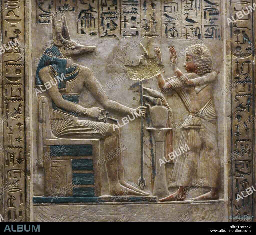 ARTE EGIPCIO. EGIPTO. Estela del escriba real Ipi. Se representa al difunto realizando ofrendas ante el dios Anubis. Segunda mitad del siglo XIV a. C. Imperio Nuevo. Dinastía XVIII. Caliza policromía. The State Hermitage Museum. San Petersburgo. Rusia.