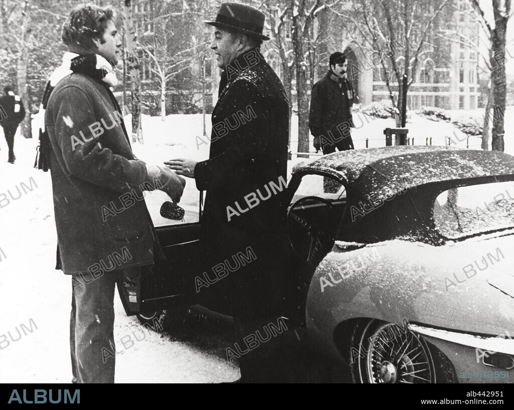 RAY MILLAND and RYAN O'NEAL in LOVE STORY, 1970, directed by ARTHUR HILLER. Copyright PARAMOUNT PICTURES.