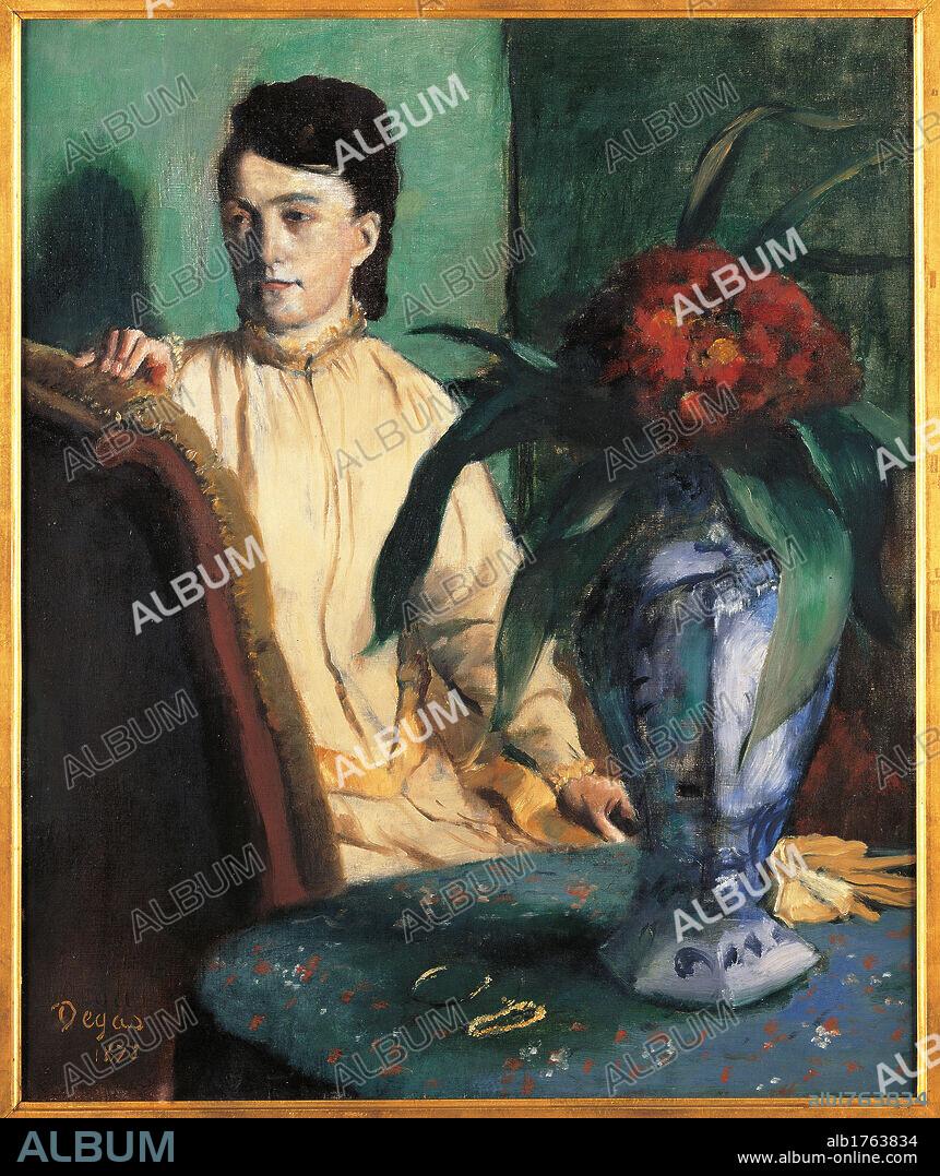 A Woman Seated beside a Vase of Flowers, by Edgar Degas, 1872, 19th Century, oil on canvas, cm 65 x 54. France, Ile de France, Paris, Muse dOrsay. All. Portrait of a woman beside a vase of flowers blue green red leaf table armchair dress yellow gloves.