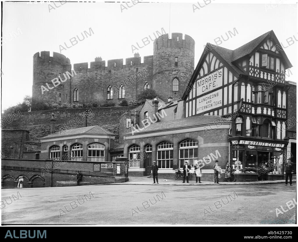 LONDON MIDLAND AND SCOTTISH RAILWAY. Morris's Cafe, Castle Gates, Shrewsbury, Shropshire, 1933. Figures standing outside Morris's Cafe at 13 Castle Gates, with the main hall of Shrewsbury Castle atop the hill behind.