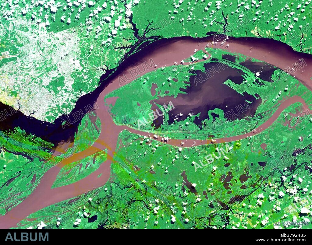 Satellite image of the junctions of the Amazon and the Rio Negro Rivers at Manaus, Brazil. The Rio Negro flows 2300 km from Columbia, and is the dark current forming the north side of the river. It gets its color from the high tannin content in the water. The Amazon is sediment laden, appearing brown in this simulated natural color image. Manaus is the capital of Amazonas state, and has a population in excess of one million. This image covers an area of 60 x 45 km and was acquired on July 16, 2000 by the Advanced Spaceborne Thermal Emission and Reflection Radiometer (ASTER) on NASA's Terra satellite.