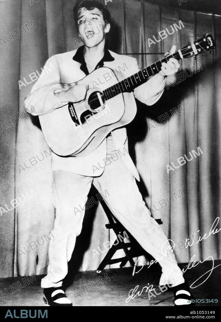 The American singer Elvis Presley during a performance in 1955.