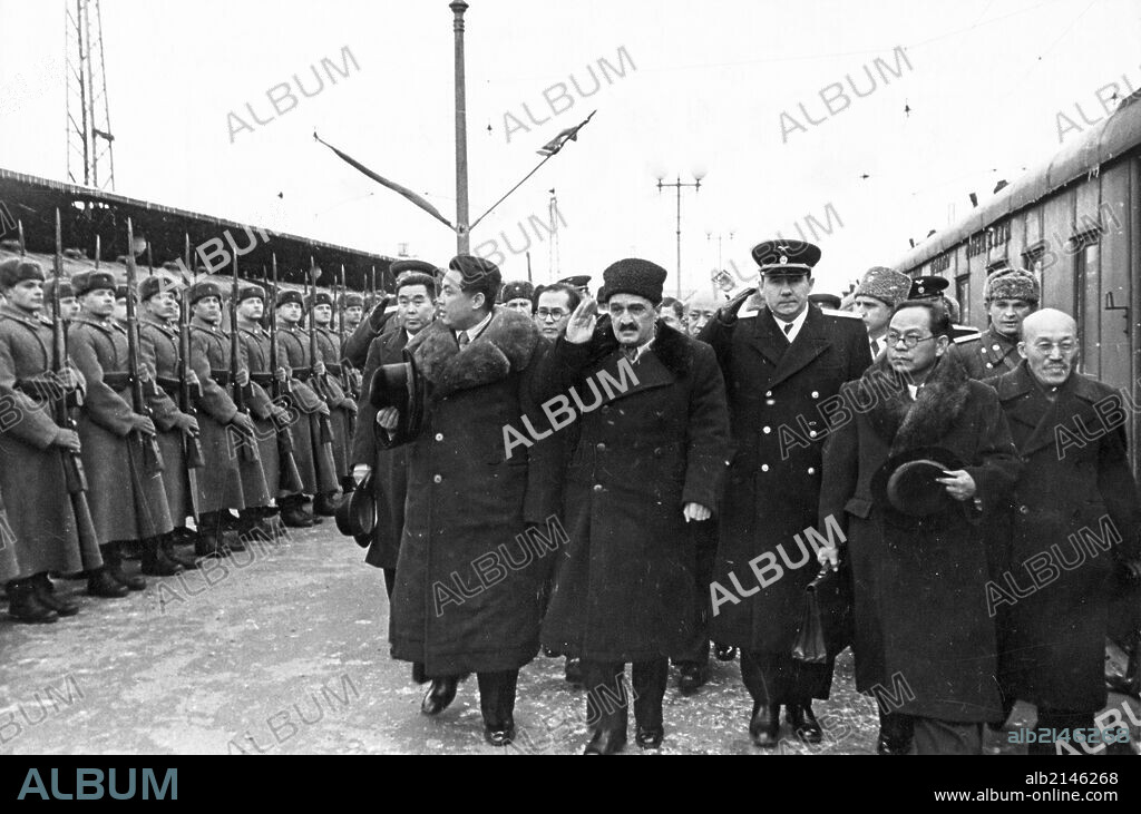 The north korean government delegation passing the honor guard at yaraslavl station upon their arrival in moscow, 1949 (?), (left to right: kim il sung, a, i, mikoyan, a, a, gromyko, pak heun yung (pak hen yen) .