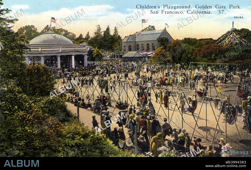 Children's playground, Golden Gate Park, San Francisco, California, USA, 1922. Vintage postcard showing hundreds of children and adults playing on the playground equipment in front of a pavillion. Golden Gate Park was laid out in the 1870s.
