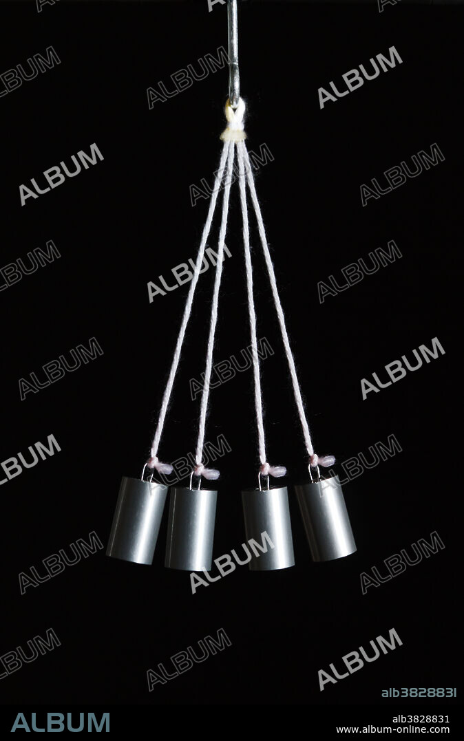 A pendulum made of an aluminium weight suspended by a string from a pivot point. The image shows how gravity accelerates the pendulum on the downswing and slows it on the upswing. Stroboscopic image acquired using a flash operating at 10 Hz.