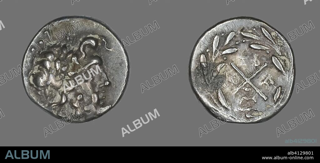 ANCIENT GREEK. Hemidrachm (Coin) Depicting the God Zeus Amarios. Greek, minted in Messene. Date: 191 BC-146 BC. Dimensions: Diam. 1.5 cm; 1.96 g. Silver. Origin: Ancient Greece.
