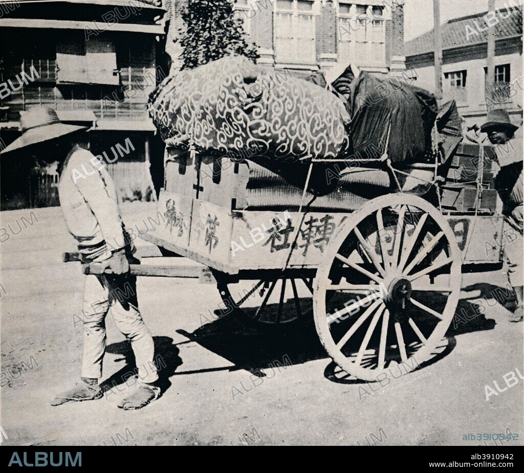 'The Japanese are not slave to possessions. Most can move house by hand-cart', c1900, (1921). From Mysterious Japan, by Julian Street. [Doubleday, Page & Company, New York & Toronto, 1921].