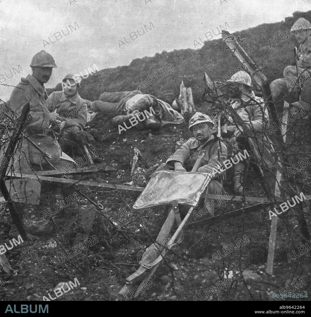 ''Offensive en Artois; Apres la prise de Souchez: une halte sur la pente de la cote 119 dominant le bourg', 1915 (1924). From "L'Album de la Guerre 1914-1919, Volume I" [L'Illustration, Paris, 1924].