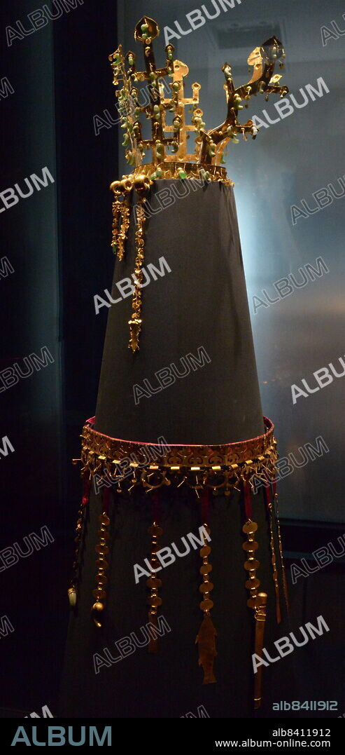 The Gold crown of Silla from Hwangnamdaechong, housed in the National Museum of Korea. It is a National Treasure of Korea. The height of the crown is 27.5 centimetres and the gold chains and pendants that dangle from the crown, known as Suhasik are 13 to 30.3 centimetres in length. The crown is known for its abundant use of jade. The Suhasik are grouped into two groups of three and are arranged with the longest chains on the outer edge to the smallest chains closest to the front of the crown. second half of 5th century. Excavated from the north mound of Hwangnam Daechong Tomb.