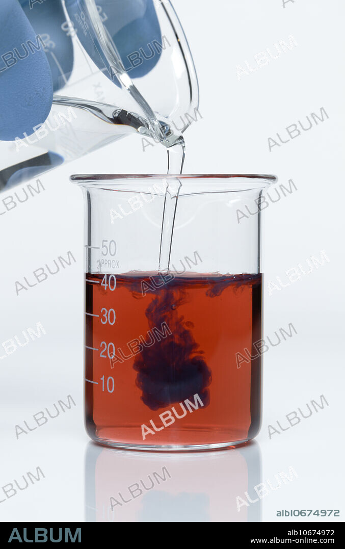 Cobalt hydroxide formation, 1 of 3. When 1.4M ammonia (NH4OH) is poured into a beaker with 0.2M cobalt(II) chloride (CoCl2), blue-green cobalt(II) hydroxide (Co(OH)2) is formed. The reaction is CoCl2 + NH3OH -> Co(OH)2 + NH4Cl.
