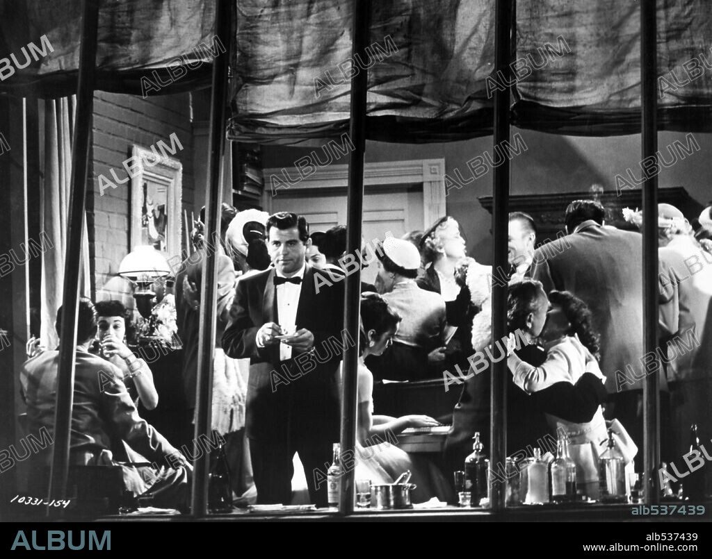 ROSS BAGDASARIAN in REAR WINDOW, 1954, directed by ALFRED HITCHCOCK. Copyright PARAMOUNT PICTURES.