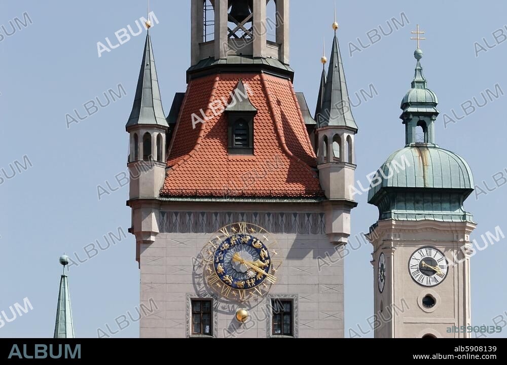 Munich (Bavaria), Altes Rathaus (Old City Hall), (built from 1470-80; architect: Jörg von Halspach. Partial view of City Hall Tower; tower of the Holy Spirit Church in the background. Photo, undated.