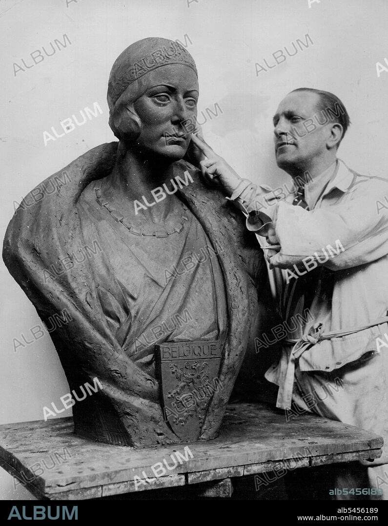New Bust Of The Queen Of The Belgians -- A magnificent bust has recently been completed of the new Queen of the Belgians, Queen Astrid. The bust is the work of M. Pierro de Soete, the famous Belgian sculpture and is to be copied to decorate all the principal buildings and all the schools of Belgium.M. Pierro de Soete puts the finishing touches to the bust of the new Queen of Belgium. April 9, 1934. (Photo by Keystone).