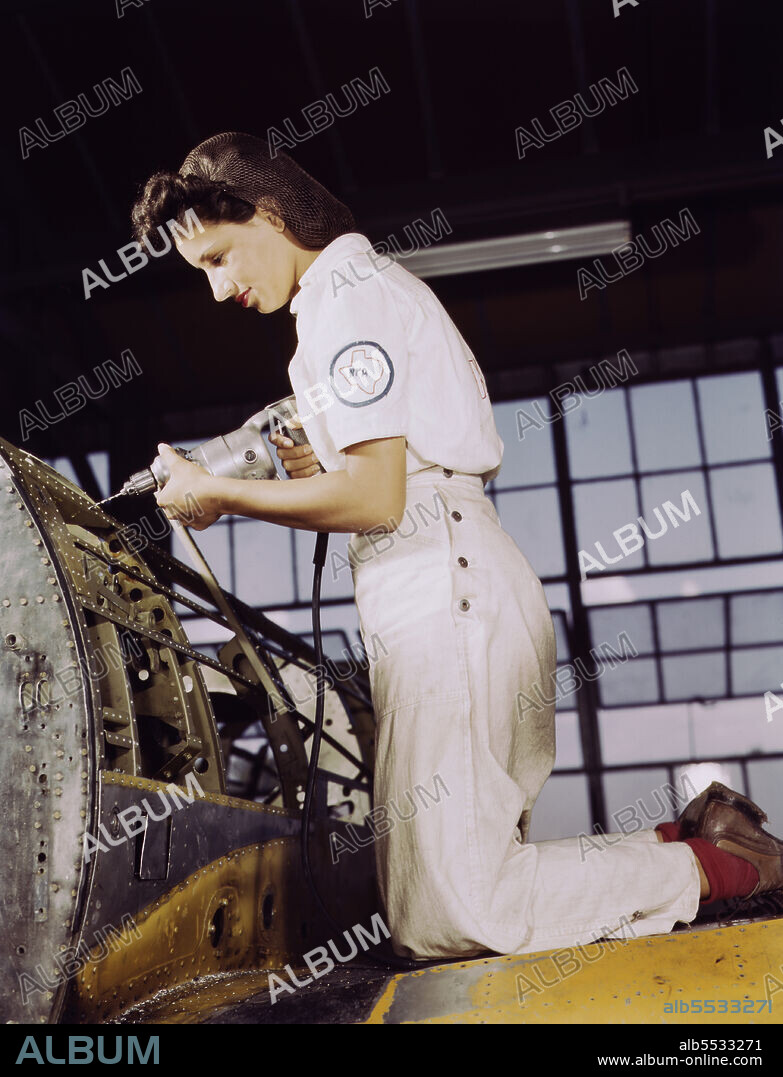 Jesse Rhodes Waller, Aviation Ordnance Mate, Third Class, trying out 30-calibre machine gun he just installed on Navy Plane, Naval Air Base, Corpus Christi, Texas, USA, Howard R. Hollem, U.S. Office of War Information, August 1942.