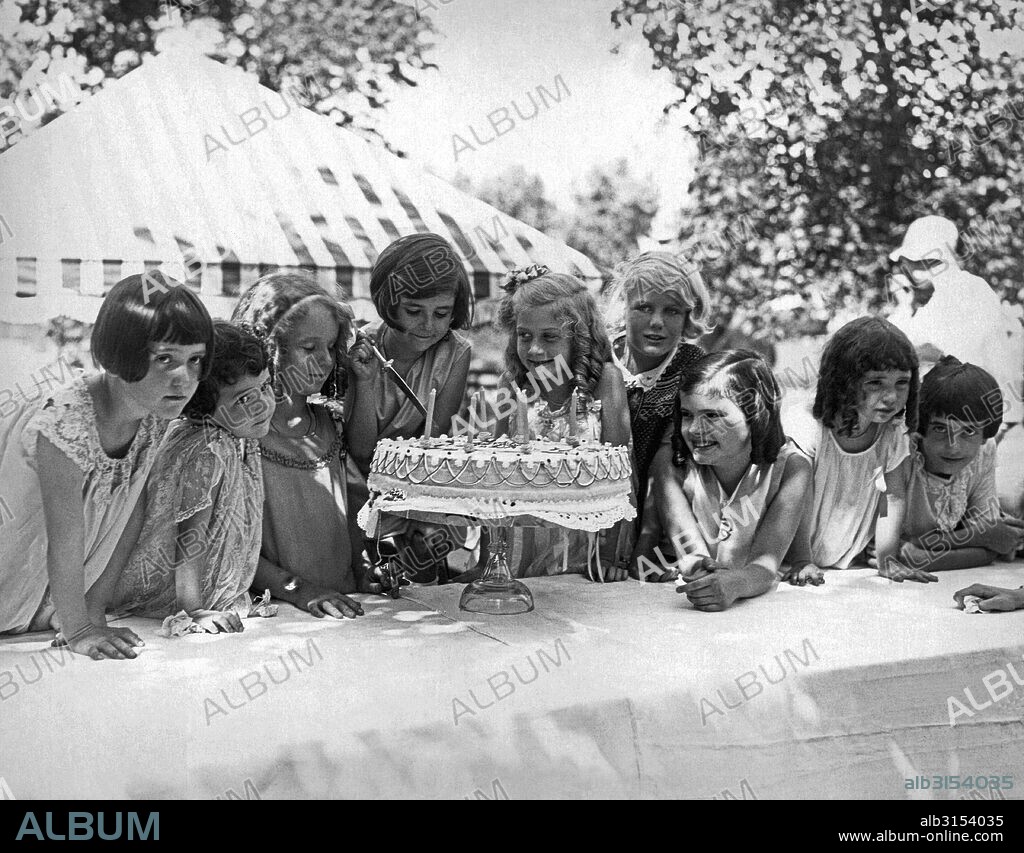 Chicago, Illinois:  August, 1928. Elena Schipa, daughter of Tito Schipa, the famous tenor and opera star, prepares to slice into her seventh birthday cake while her friends await.
