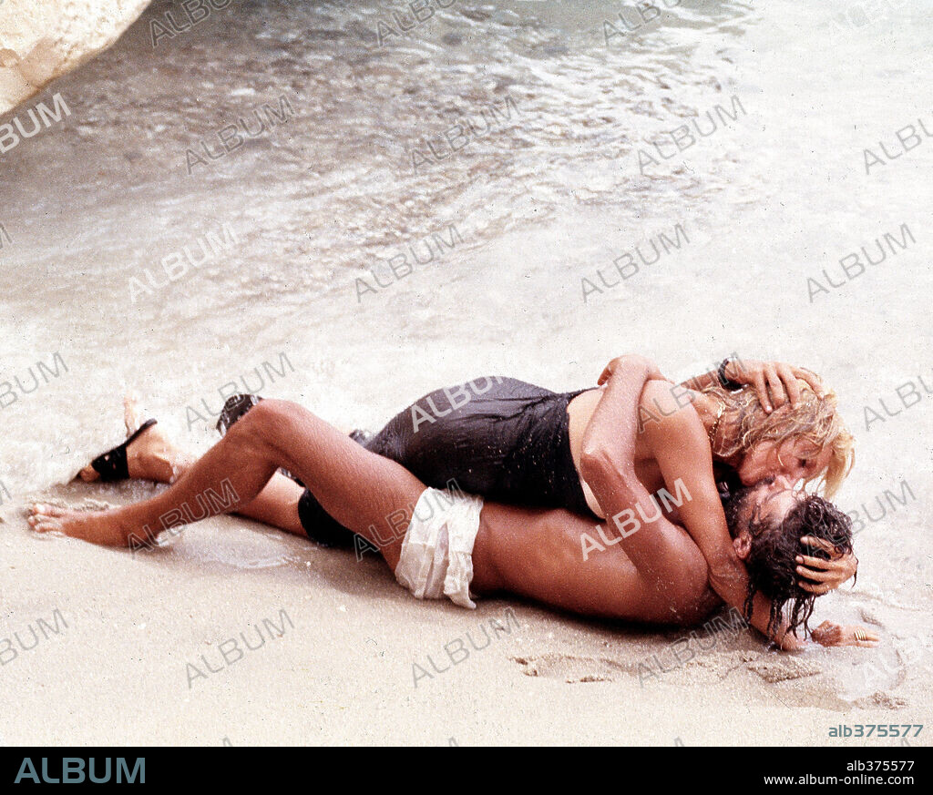 GIANCARLO GIANNINI and MARIANGELA MELATO in SWEPT AWAY, 1974 (TRAVOLTI DA UN INSOLITO DESTINO NELL'AZZURRO MARE D'AGOSTO), directed by LINA WERTMULLER.