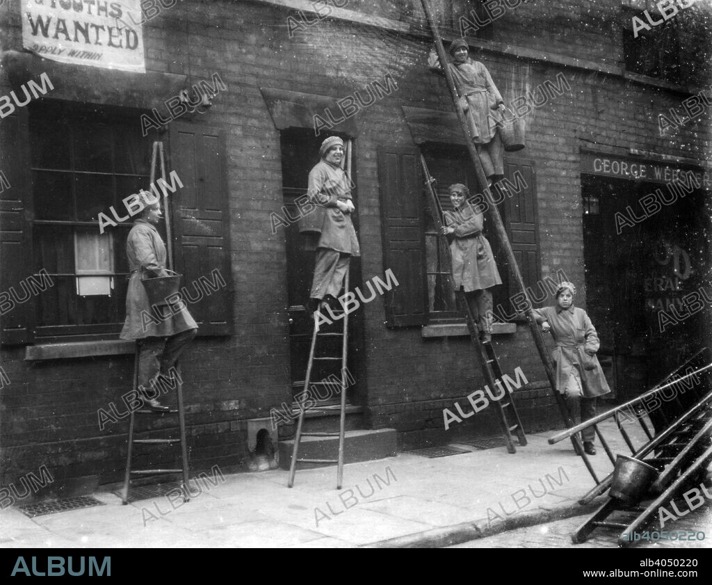 Women window cleaners, Nottingham, Nottinghamshire, 1917. These women worked for the City and Suburban Window Cleaning Company. George Webster, whose name is over the door (right), is listed in Kelly's 1916 Directory as ladder maker and manager of the Robin Hood Window Cleaning Company (premises on Peachey Street and Currant Street).