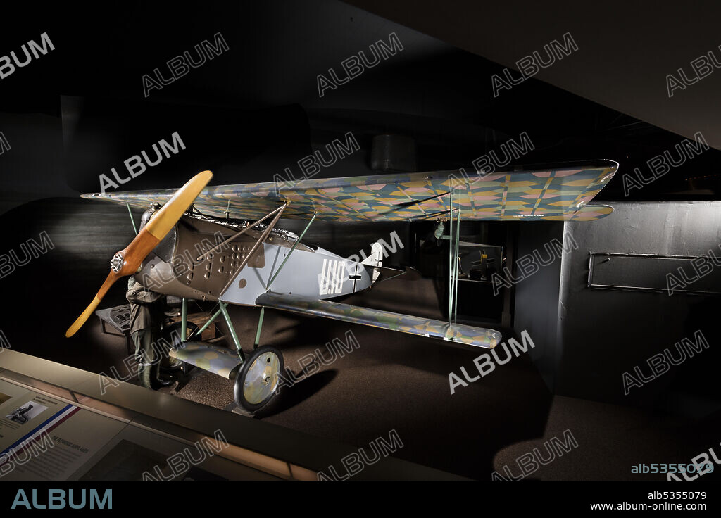 OSTDEUTSCHE ALBATROS WERKE GMBH. Single-engine, single-seat, German World War I biplane fighter; 160-horsepower Mercedes D.IIIa water-cooled engine. Lozenge camouflage on wings. Fuselage gray and olive drab. In response to the loss of air superiority in late 1917, the Germans organized a competition for new fighter designs held in January 1918. The in-line engine winner was the Fokker D.VII. Fokker received an order for 400 aircraft. To meet the demand for the new fighter, Albatros, Fokker's chief competitor, also built the D.VII under license. Ironically, Albatros built more D.VIIs than the primary contractor and the Albatros product was of higher quality. When the Fokker D.VII appeared on the Western Front in April 1918, Allied pilots at first underestimated the new fighter because of its squarish, ungainly appearance, but quickly revised their view. The D.VII's unique ability to seemingly "hang on its propeller," and fire into the unprotected underside of enemy aircraft made it a highly feared combat opponent. The Armistice agreement requirement specifically demanding that all Fokker D.VIIs be immediately surrendered attested to the general high regard for the airplane.