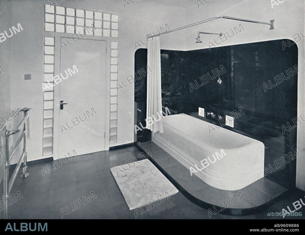'Robin Byng - Bathroom in Grosvenor Square, London, showing te Insulight glass blocks made by Pilkington Bros Ltd., used for decorative effect, and for the purpse of obtaining borrowed light for the room behind', 1939. From Decorative Art 1939 - The Studio Year Book, edited by C. G. Holme. [The Studio Ltd., London, 1939].