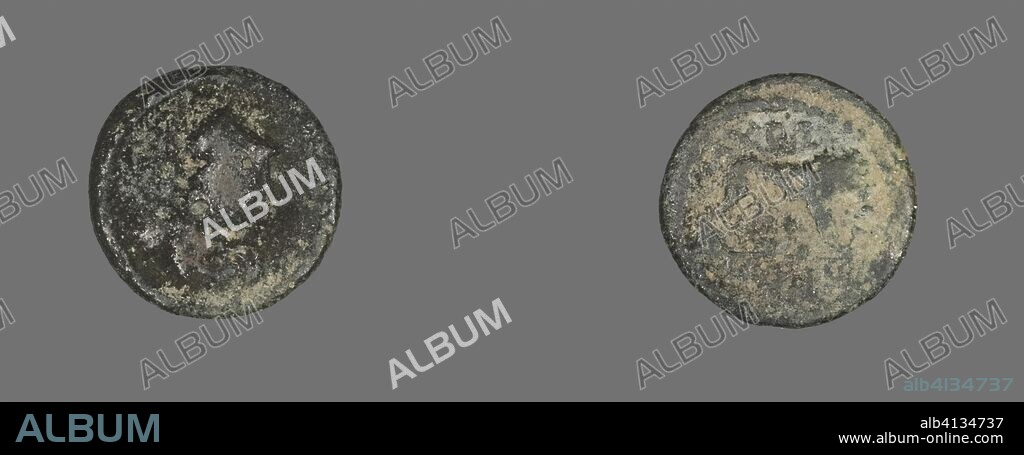ANCIENT ROMAN. Coin Depicting a Lion. Roman. Date: 193 AD-211 AD. Dimensions: Diam. 1.4 cm; 1.12 g. Bronze. Origin: Roman Empire.