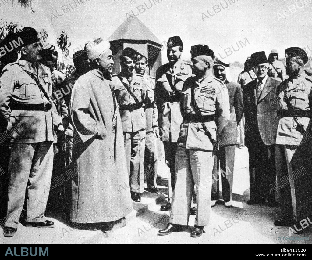 King Abdullah of Transjordan (left) with Brigadier Glubb Pasha and staff officers. Abdullah I bin al-Husayn (2 February 1882 - 20 July 1951) was the ruler of Jordan from 11 April 1921 until his assassination in 1951. He was Emir of Transjordan, a British protectorate, until 25 May 1946, after which he was King of an independent Jordan. Lieutenant-General Sir John Bagot Glubb, KCB, CMG, DSO, OBE, MC, KStJ, KPM (16 April 1897 - 17 March 1986), known as Glubb Pasha, was a British soldier, scholar, and author, who led and trained Transjordan's Arab Legion between 1939 and 1956 as its commanding general.