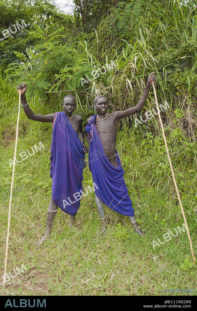 Two Surma men with scarification, Tulgit, Omo River Valley, Ethiopia, Africa.