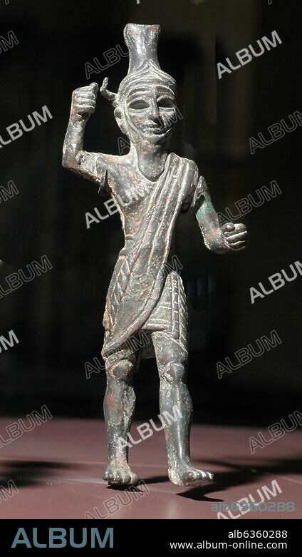 5320. Figurine of the Storm God Baal. The figurine is covered in gold and silver. The right arm is risen upwards as if brandishing a weapon (lost), the left hand extends forward perhaps holding a shield. Dating c.1300 BC, found in Ugarit, Syria.