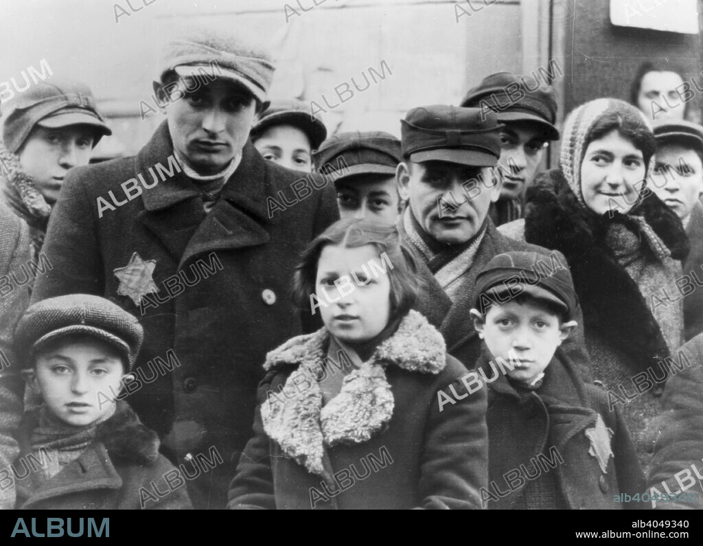 Jews wearing Star of David badges, Lodz Ghetto, Poland, World War II, 1940-1944. The Nazis forced Jews into over-crowded ghettos from which thousands were deported to the death camps.