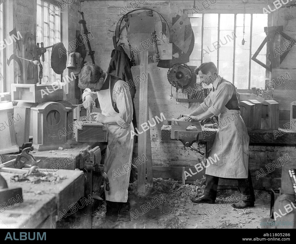Messrs Stanton and Hill, A firm of cabinet makers at High Wycombe is the only English firm making wooden clock cases. A trade which has been exclusively in the hands of the Germans and Austrians - Their first order for a thousand cases is now being executed. itting and finishing the cases.