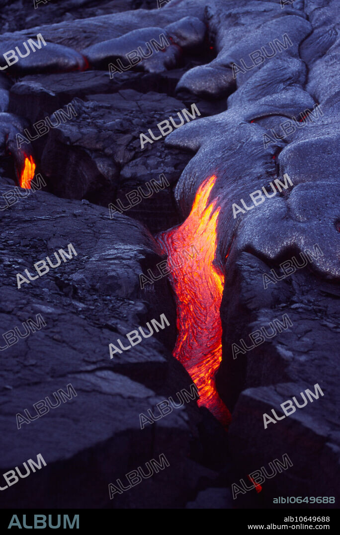 Pahoehoe lava flow from Kilauea Volcano; Hawaii Volcanoes National Park, Island of Hawaii, Hawaii, USA. Pahoehoe is one of the basic types of lava flows. It has a smooth, undulating appearance, due to the movement of very hot, fluid lava under the congealing surface crust.