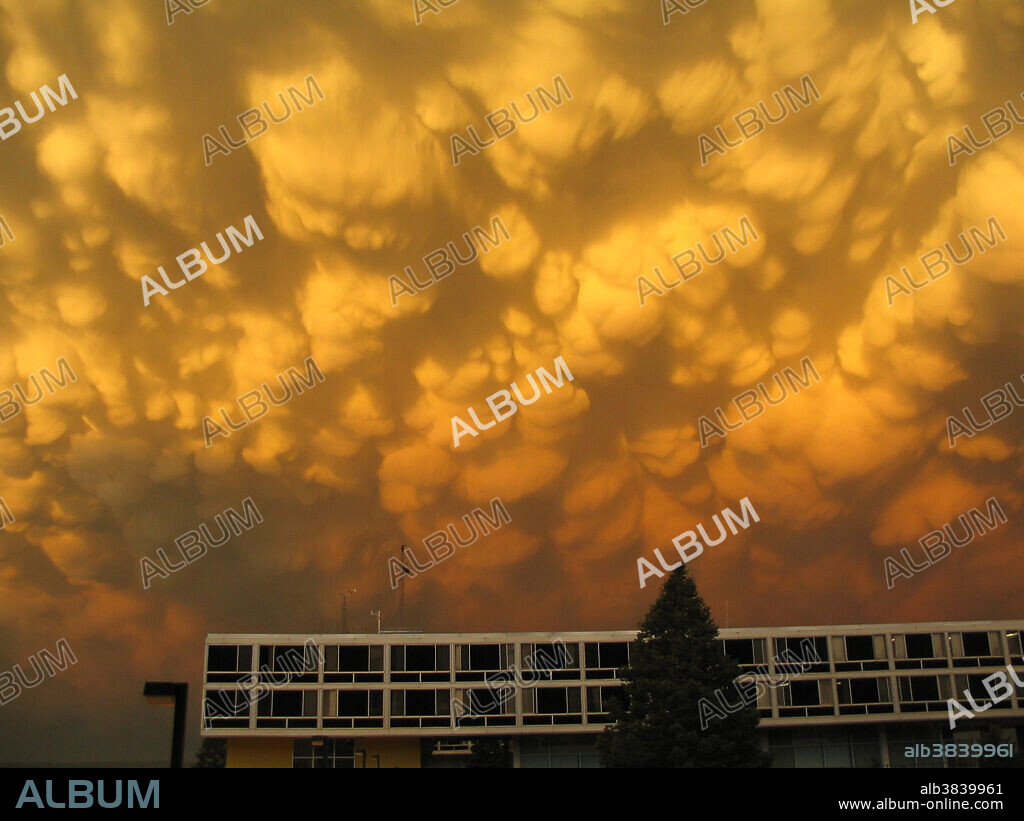 Mammatocumulus over the United States Air Force Academy. Colorado Springs, Colorado. August 10, 2004. Mammatocumulus is a meteorological term applied to a cellular pattern of pouches hanging underneath the base of a cloud. Mammatus are most often associated with the anvil cloud and also severe thunderstorms. They may appear as smooth, ragged or lumpy lobes and may be opaque or semitransparent.