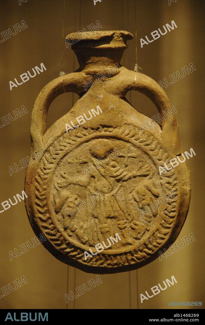 ARTE PALEOCRISTIANO. EGIPTO. Frasco (AMPULLAE) de arcilla que representa a SAN MENAS FLANQUEADO POR DOS CAMELLOS. Fechado en el siglo VII. Procede del santuario de San Menas en Egipto. Museo Bizantino. Atenas. Grecia.