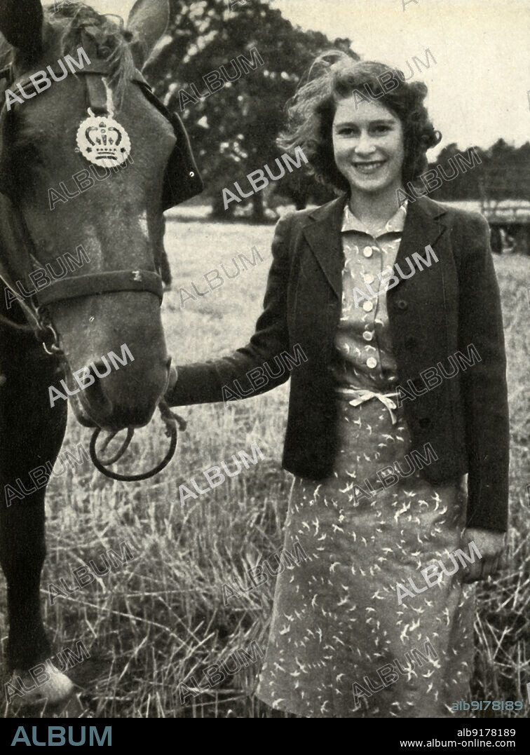 'Harvest Time', 1943, (1947). Princess Elizabeth (future Queen Elizabeth II) with one of the farm horses at Sandringham in Norfolk. From "Princess Elizabeth: The Illustrated Story of Twenty-one Years in the Life of the Heir Presumptive", by Dermot Morrah. [Odhams Press Limited, London, 1947].