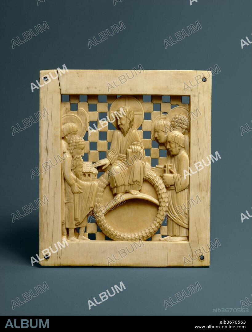 Plaque with Christ Receiving Magdeburg Cathedral from Emperor Otto I. Culture: Ottonian. Dimensions: Overall: 5 1/8 x 4 7/16 x 5/16in. (13 x 11.3 x 0.8cm). Date: ca. 962-968.
One of the most famous ivory carvings to survive from the tenth century, this plaque depicts Christ enthroned against an open worked checkerboard background.  He is blessing a model of a church presented to him by Emperor Otto the Great (r. 962-973) and a host of saints including Peter, who holds his attribute, the keys.  The ivory was destined for Otto's imperial church dedicated to Saint Mauritius in Magdeburg (Saxony) which was raised to the seat of an archbishopric in 968.  This plaque, and an accompanying series of New Testament and symbolic scenes, must have been made for the dedication of the church in that year.  This ensemble may have been part of some liturgical furnishing such as a chancel door, a pulpit, or an altar frontal.  Probably carved in Milan, an important imperial and artistic center, the engaging style of the ivories with their uncomplicated figures, geometric setting, and emphatic gestures seem to assimilate features of both the Carolingian artistic tradition and that of Byzantium.