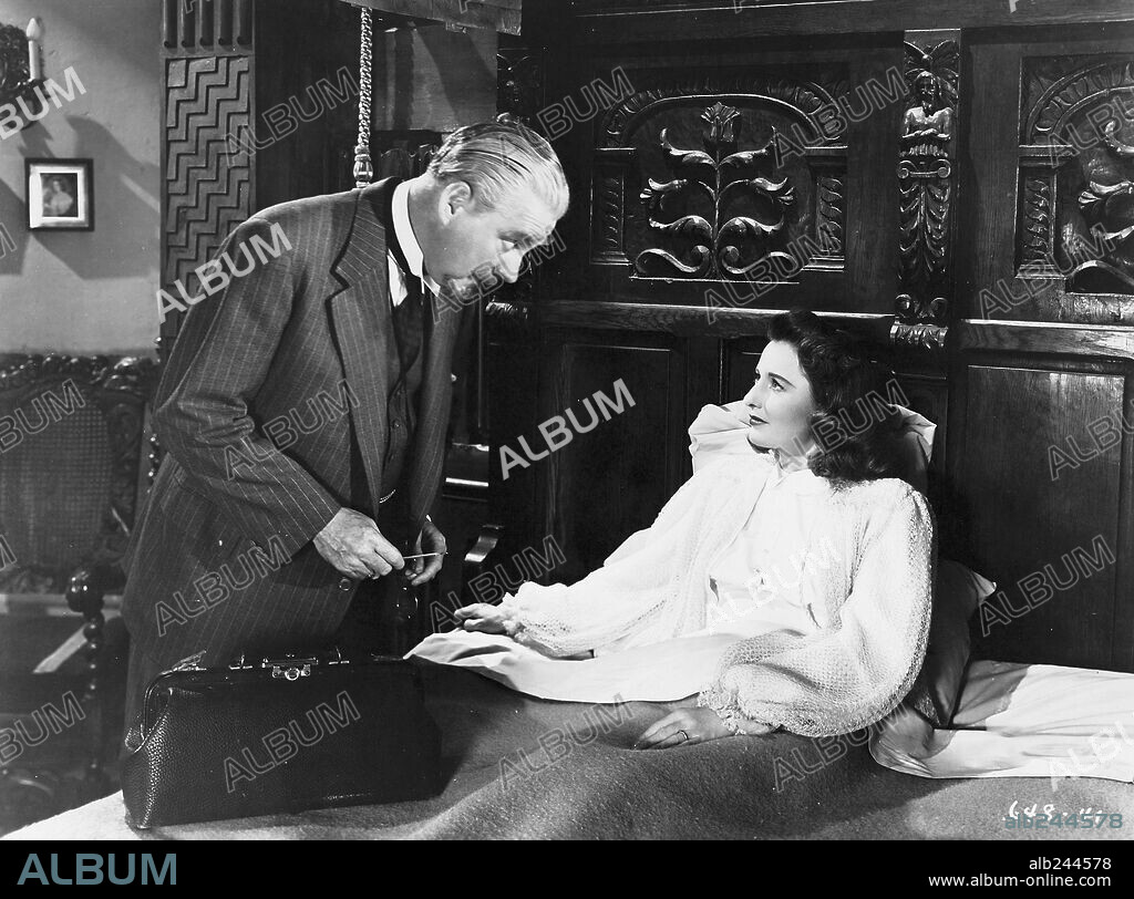 BARBARA STANWYCK and NIGEL BRUCE in THE TWO MRS. CARROLLS, 1947, directed by PETER GODFREY. Copyright WARNER BROTHERS.