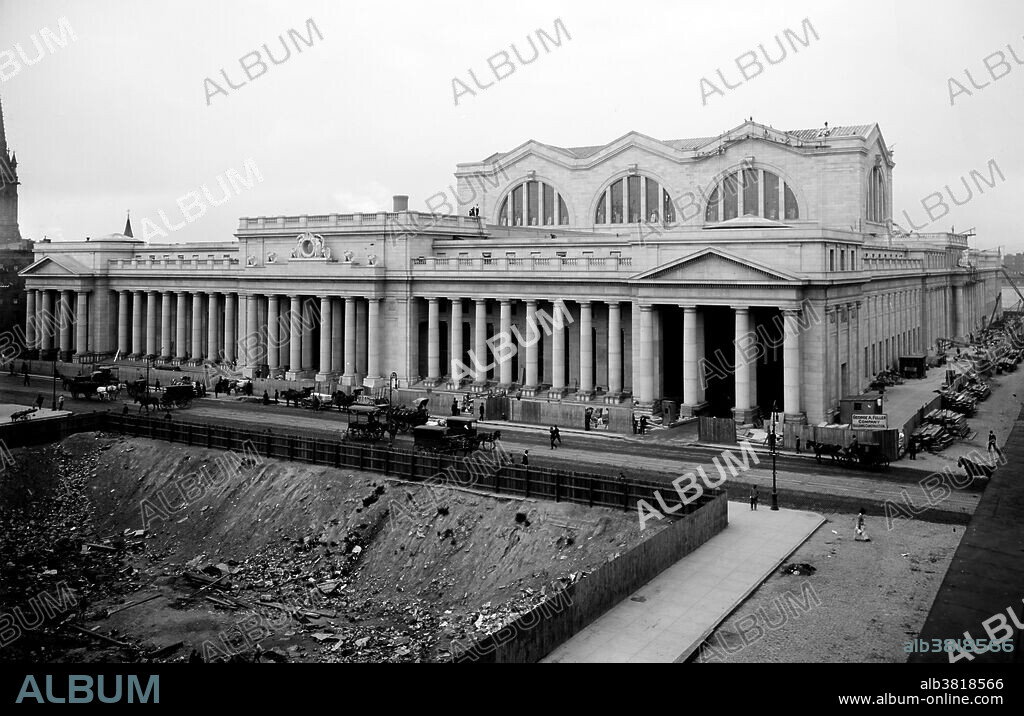 Pennsylvania Station was a historic railroad station, named for the Pennsylvania Railroad, its builder and original tenant, and shared its name with several stations in other cities. It was designed by McKim, Mead, and White and completed in 1910. The original Pennsylvania Station was considered a masterpiece of the Beaux-Arts style and one of the architectural jewels of New York City. Occupying two city blocks from Seventh Avenue to Eighth Avenue and from 31st to 33rd Streets, the original Pennsylvania Station building was 784 by 430 feet, covering an area of 8 acres. As rail usage declined in the 1950s, the Pennsylvania Railroad sold the air rights to the property and downsized the railroad station. The above ground head house and train shed of the station were demolished and replaced by Madison Square Garden and Pennsylvania Plaza between 1963 and 1969. The destruction of Pennsylvania Station galvanized support for architectural preservation across the United States, leading to the advent of modern historical preservation. Image from the Detroit Publishing Company circa 1910-1920.
