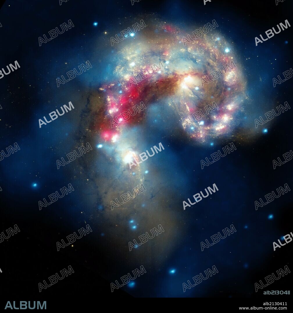The Antennae galaxies, located about 62 million light-years from Earth, are shown in this composite image. The collision, which began more than 100 million years ago and is still occurring, has triggered the formation of millions of stars in clouds of dusts and gas in the galaxies. Hubble and Spitzer. (Photo by: Universal History Archive/UIG via Getty Images).