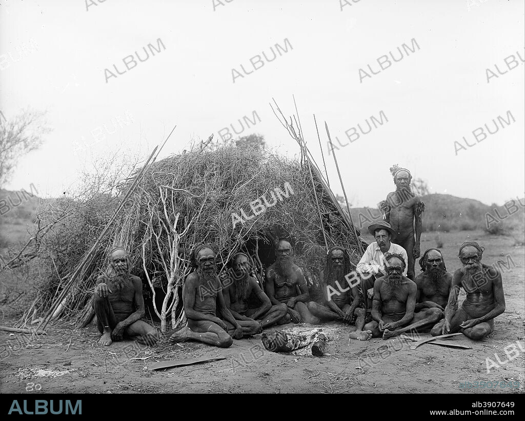 WALTER BALDWIN SPENCER AND FRANCIS J GILLEN. Baldwin Spencer seated with the Arrernte elders, Alice Springs, Central Australia, 1896. Date/Period: 1896. Image. Glass plate negative Glass plate negative. Height: 160 mm (6.29 in); Width: 210 mm (8.26 in).