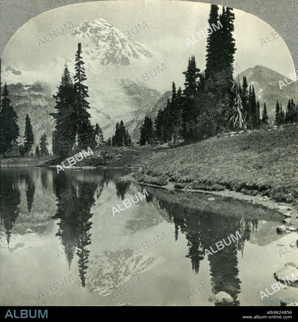 'Mt. Rainier from Mirror Lake, Indian Henry's Hunting Ground, Mt. Rainier National Park, Washington', c1930s. From "Tour of the World". [Keystone View Company, Meadville, Pa., New York, Chicago, London].