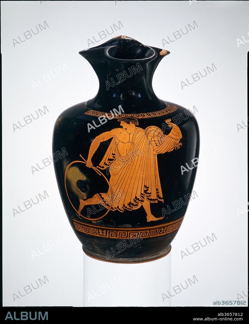Terracotta oinochoe: chous (jug). Culture: Greek, Attic. Dimensions: H. 6 1/2 in. (16.5 cm)
diameter  4 5/16 in. (11 cm). Date: ca. 470 B.C..
Ganymede with gamecock and hoop
Renowned for his beauty, Ganymede was a scion of the Trojan royal house. Zeus desired him to be the gods' cupbearer on Mount Olympos. Representations of the late sixth and fifth centuries B.C. show Ganymede being carried off by Zeus himself; beginning in the fourth century, Zeus is replaced by an eagle. The Pan Painter perfectly depicts the boy as he runs along. The subject is fitting for a jug from which wine was poured.